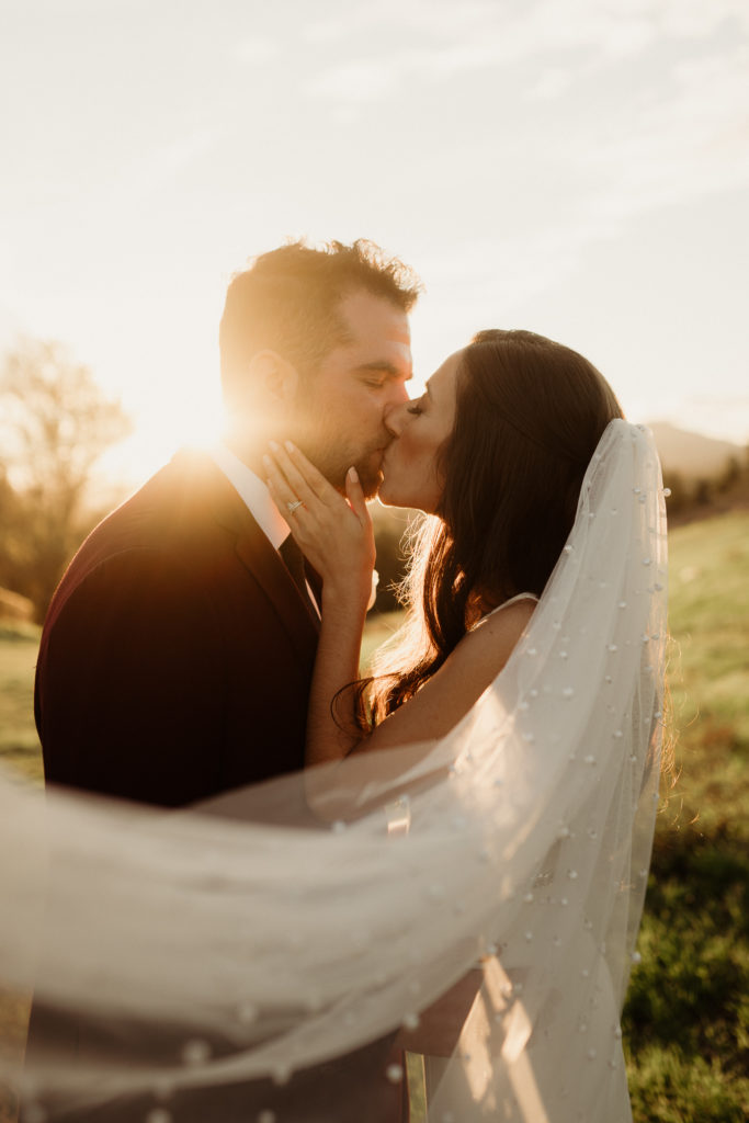 bride and groom kiss during golden hour romantics in los angeles, ca