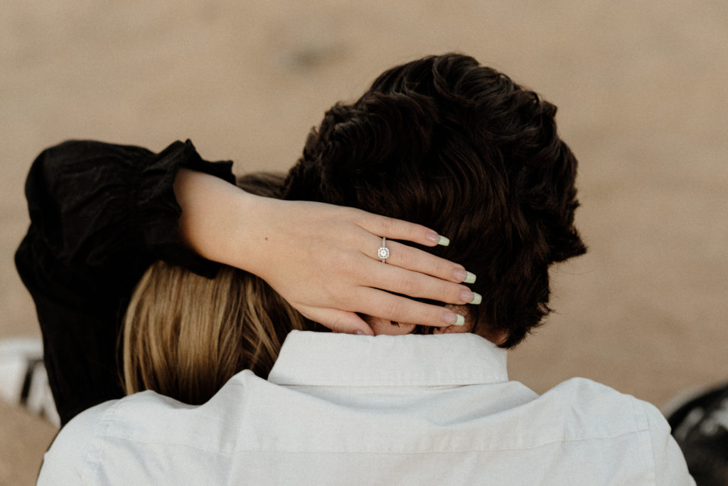 couple engagement photos in joshua tree national park showing the ring