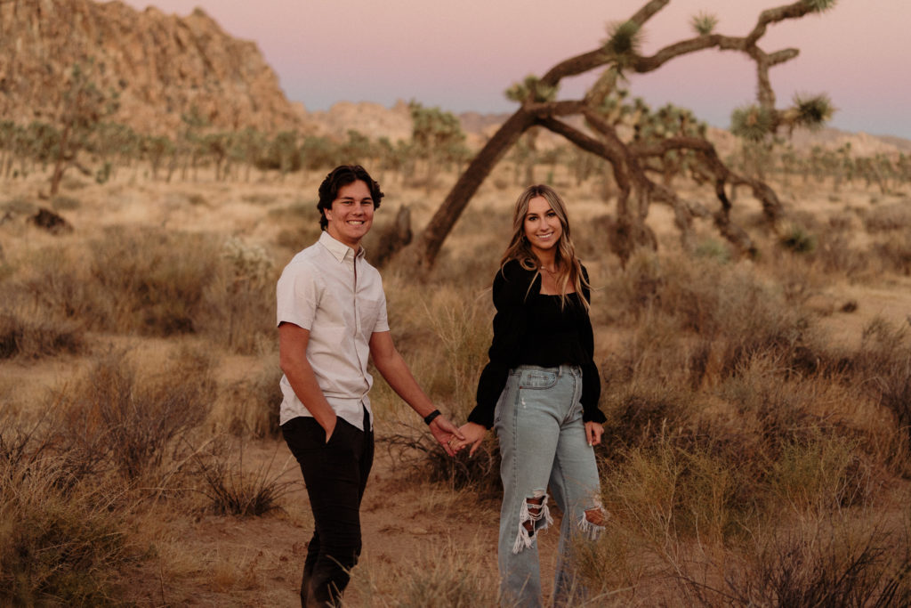 couple engagement photos in joshua tree national park at sunset