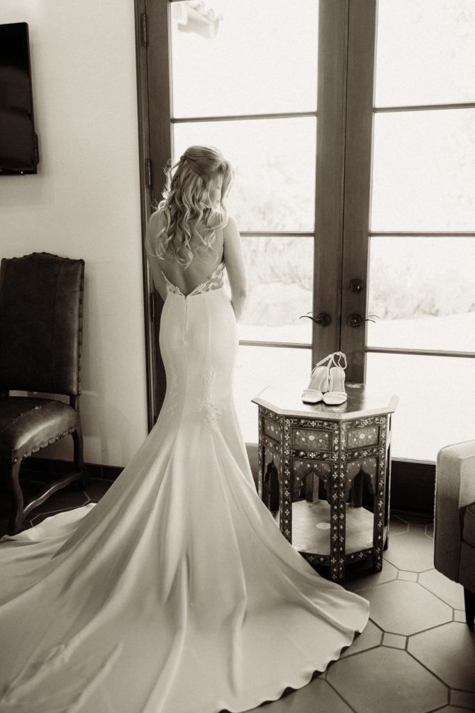 quail ranch simi valley wedding bride in her wedding dress looking out the window