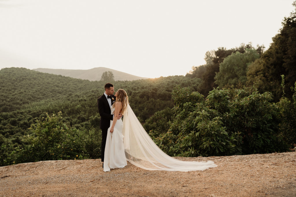 bride and groom golden hour romanitics at quail ranch wedding venue in simi valley ca