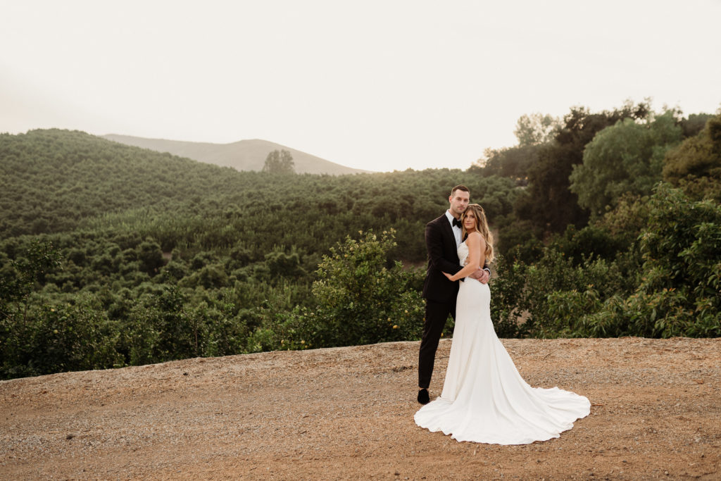 bride and groom golden hour romanitics at quail ranch wedding venue in simi valley ca