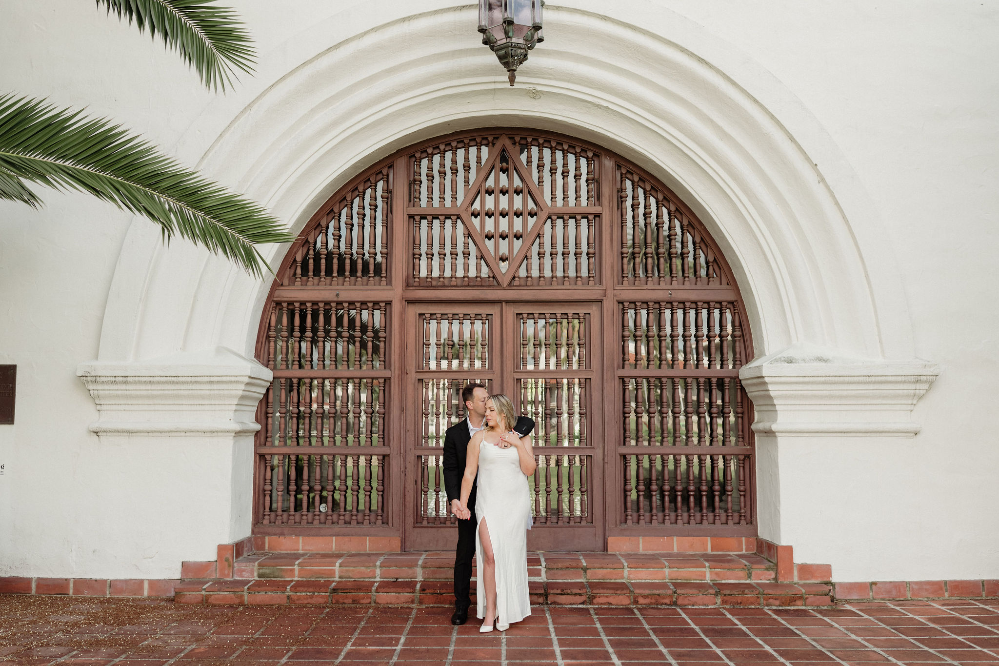 bride and groom editorial pose at the santa barbara courthouse