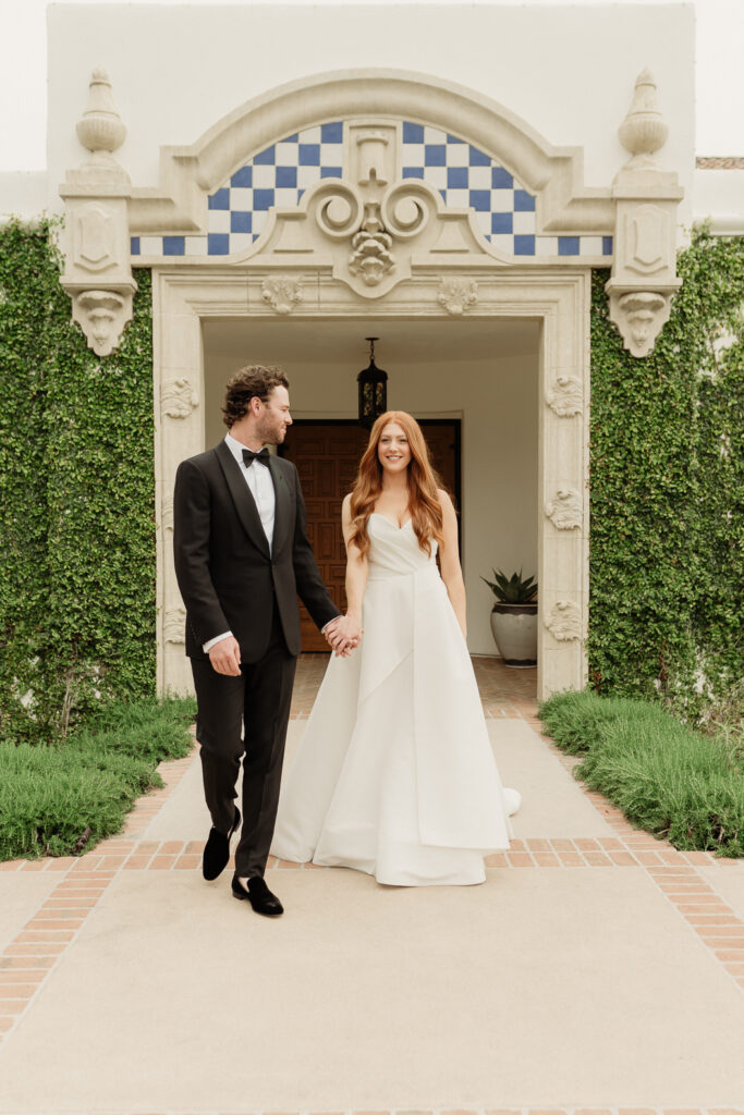 bride and groom walking at the montecito club
